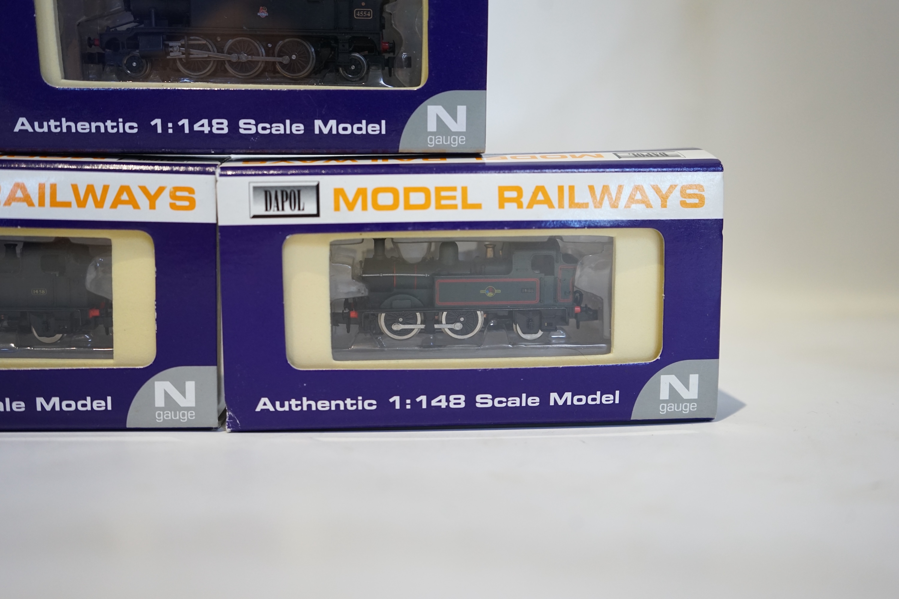 Three boxed Dapol N gauge railway BR tank locomotives; a Class 14xx, 1458 (ND002), a Class 14xx, 1466 (ND003), and a Class 45xx, 4554 (ND-019). Condition - good.